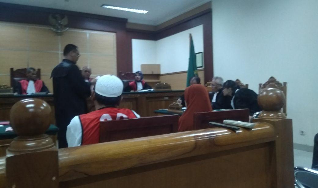 kasus koapgi tersangka